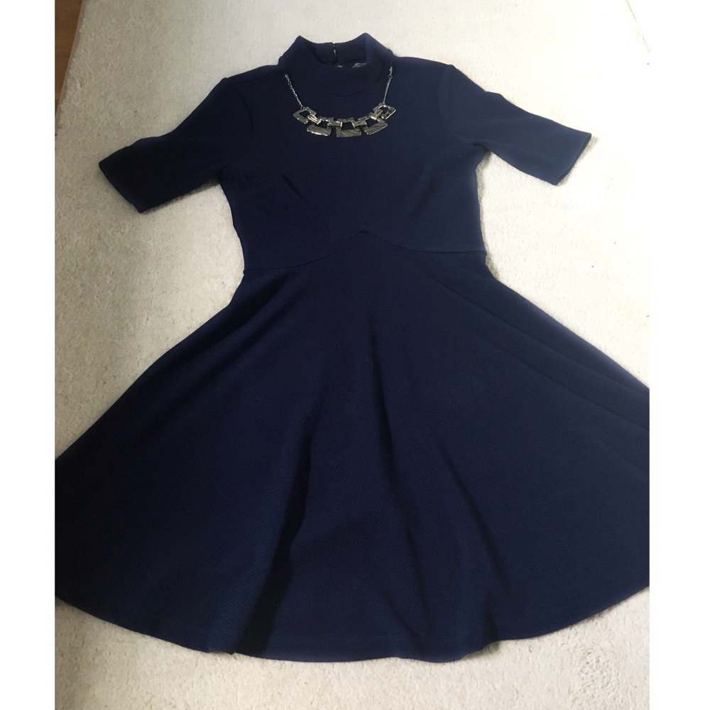 Navy blue dress with attached silver necklace.